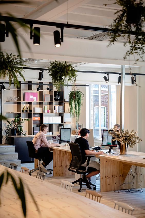 An office with desks made of wood and an industrial feel